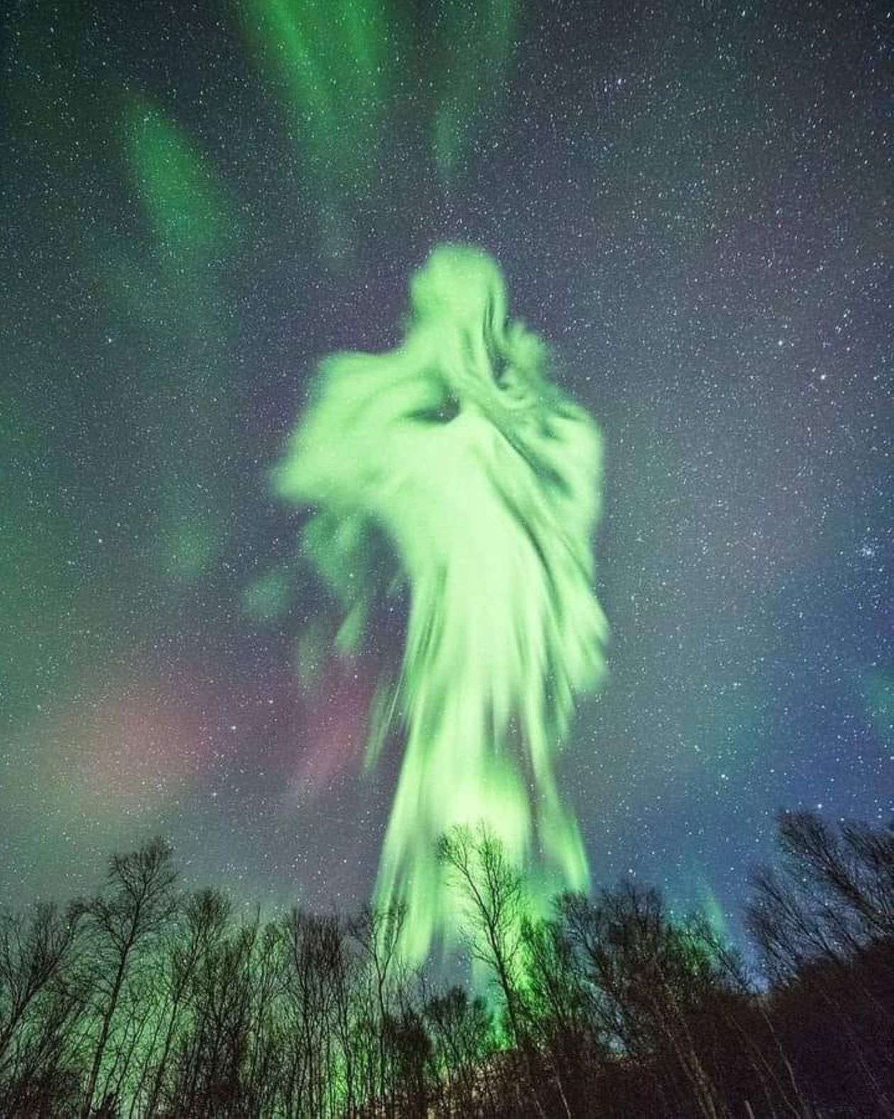 The Giant holographic glowing Ghost Aurora Rises opens its eyes and laughs