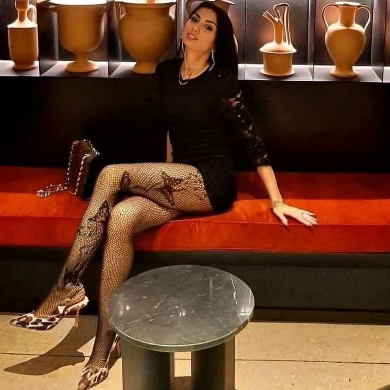 Woman waiting for someone at the old bar restaurant. A restored 1920 prohibition Chicago Steakhouse and barrelic steampunk engine