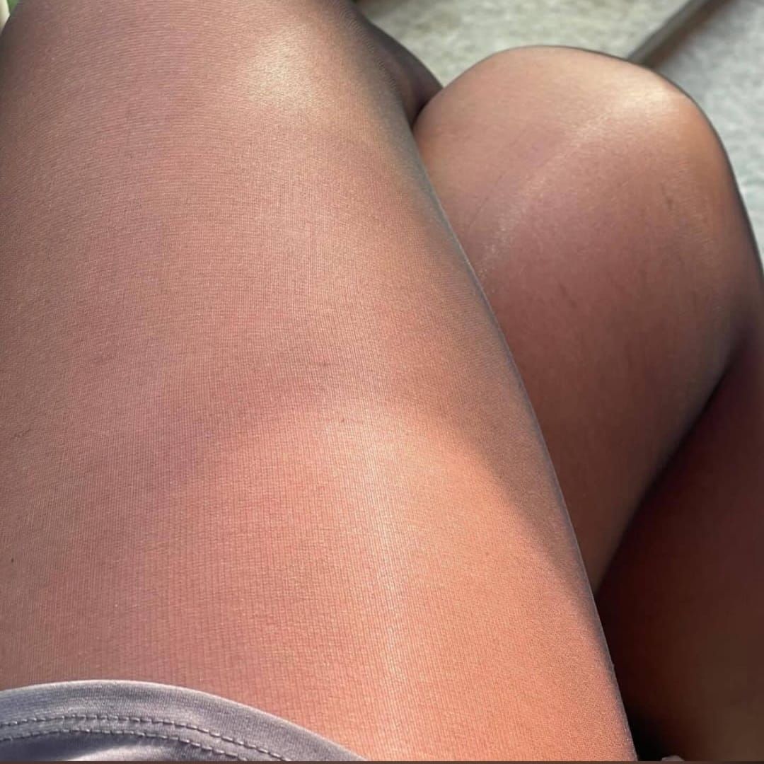"The Leg Cross..1"

Close-up view of two legs, wearing sheer, light brownish-gray tights.  The skin tone appears smooth and slightly reflective, showing texture...