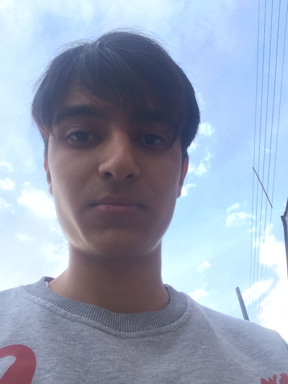 Analyze the uploaded image: detect the main person’s gender, age range, clothing style, and the environment. Create a new image that keeps t...