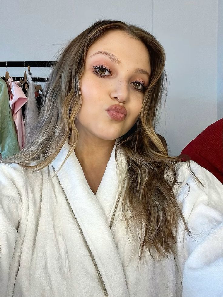 In hospital getting ready for surgey in towel getting onto surgey table bare foot getting lines drawing on her for surgey