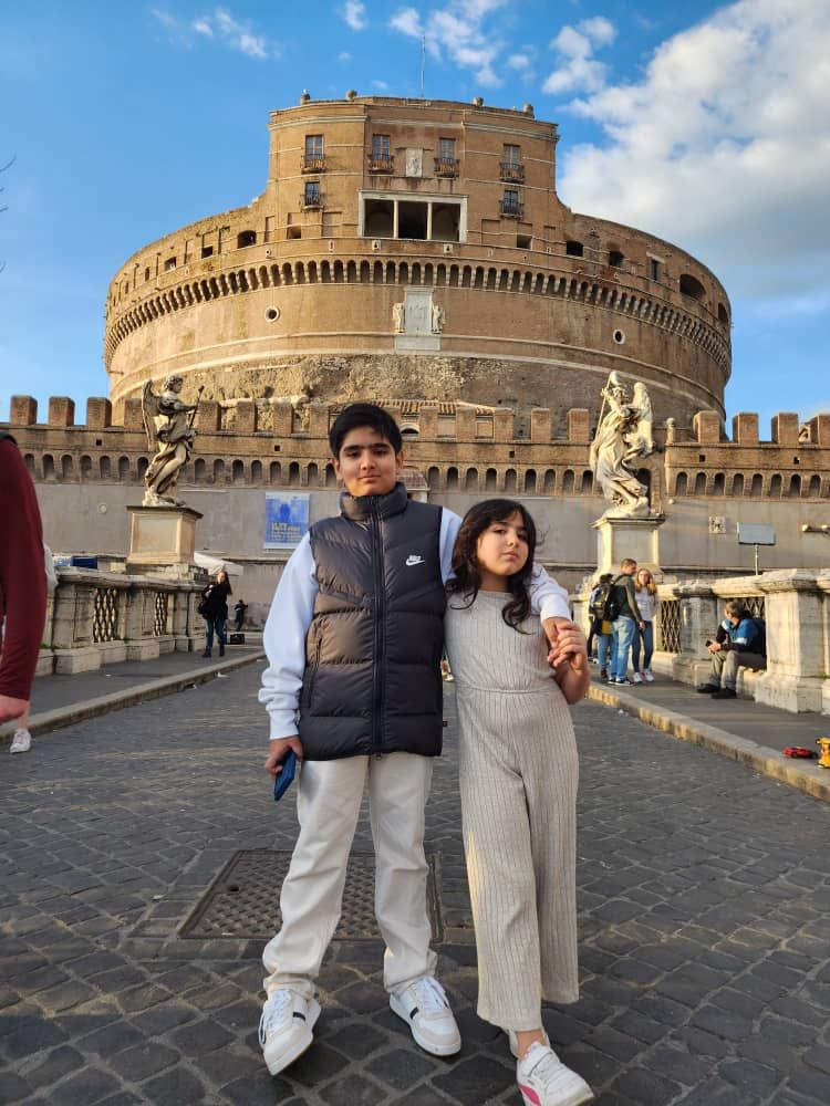 A monkey is driving motor cycle . This monkey has hat . Write these words on her hat " i want occo cafe "