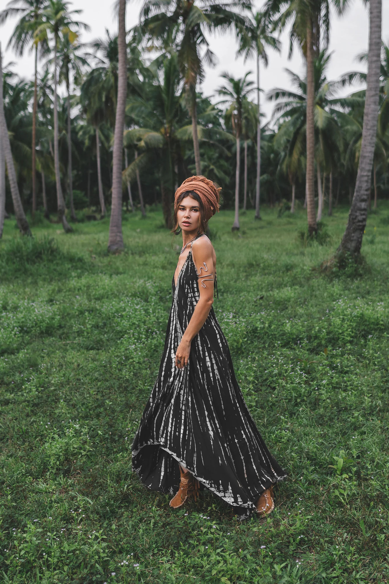 the iconic picture of a noble woman with a red and black dress , 17th century, french court, she walks in a garden of red roses with thorns,...