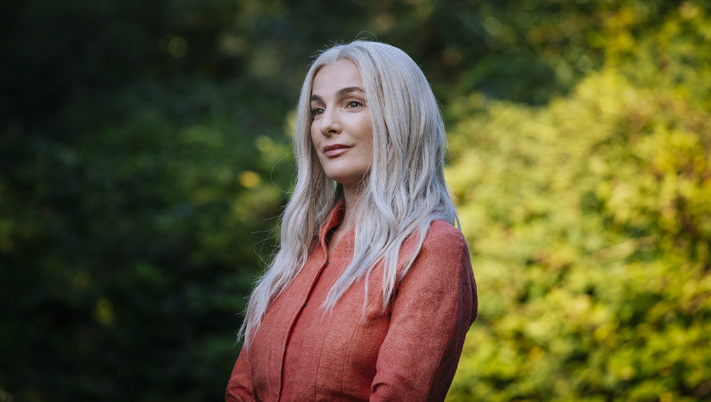 a beautiful priestress woman, tatoos, mystical jewelry, atmosphere of savagery and blood everywhere, Cinematic film still, shot on v-raptor...