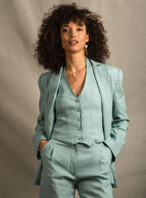 the cinematographic pictures of a young badass special agent walking into a rich mansion beside a swimming pool, in miami , very long white...