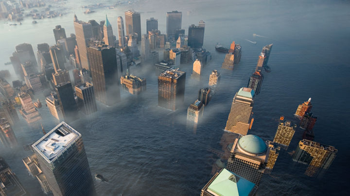 A ruined flooded modern city with a shanty town at water level
