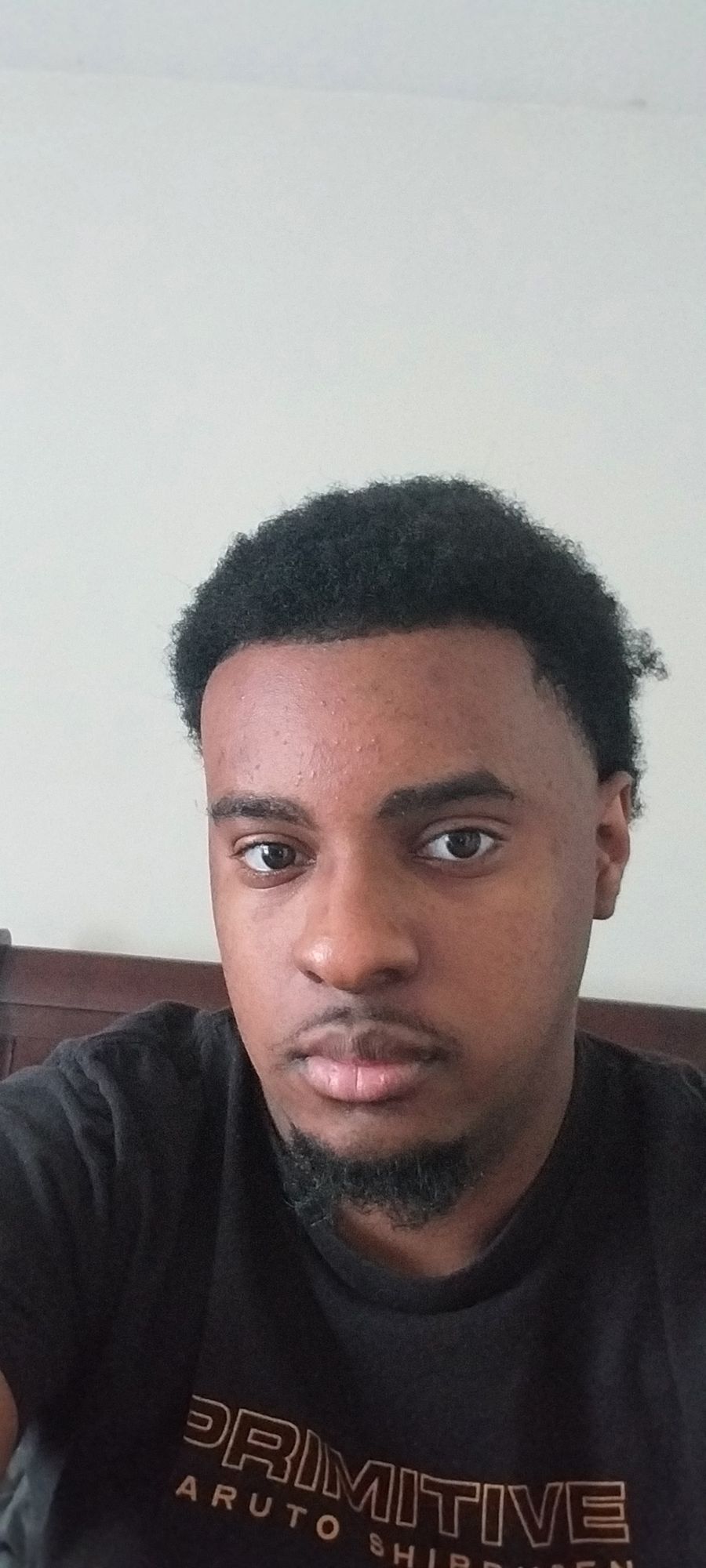 A solitary, weathered lighthouse stands defiantly against a tempestuous sea, its beam cutting through the thick fog. Waves crash against the...