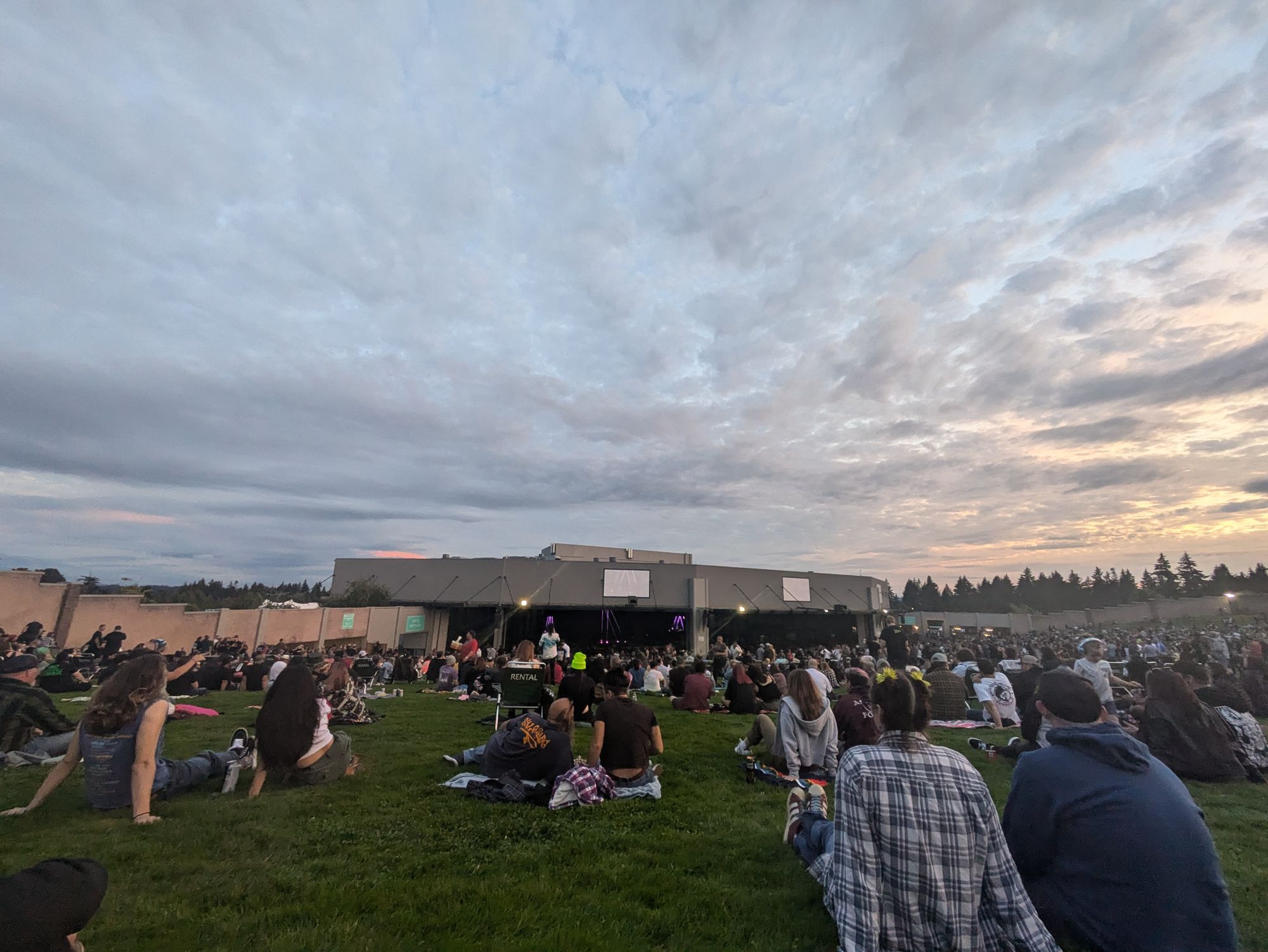 A field of people watching music music emanates through the air creating magic. 