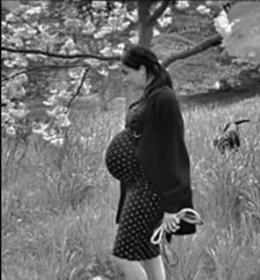 Megan markle  reggae yellow and red green and black no sleeves dress and hair low bun

