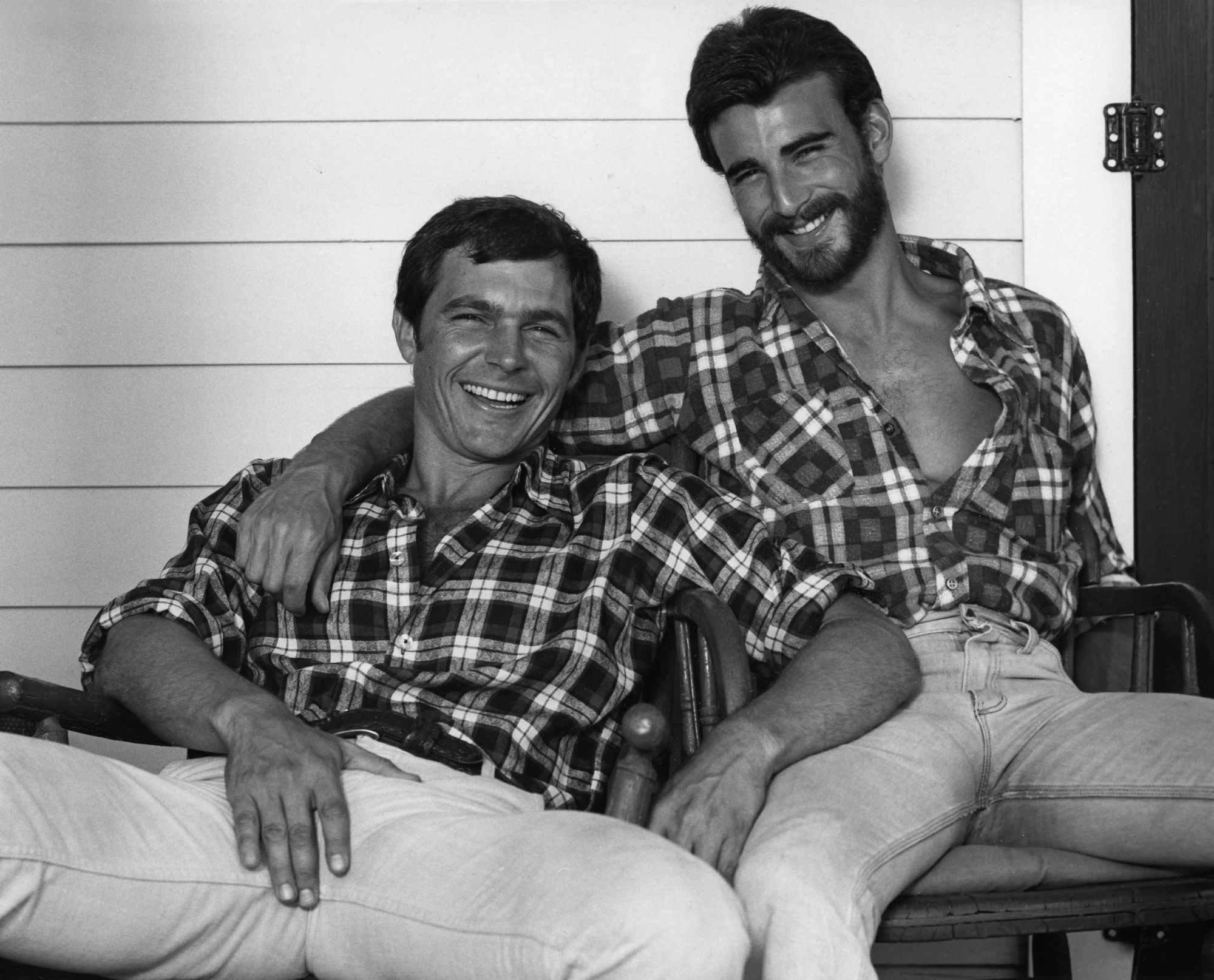 <lora:Crimi:1.0> <lora:Dark Steel:1.0> <lora:Murraypunk Flux:1.0> A close-up shot features two men in an intimate embrace against a blurred,...