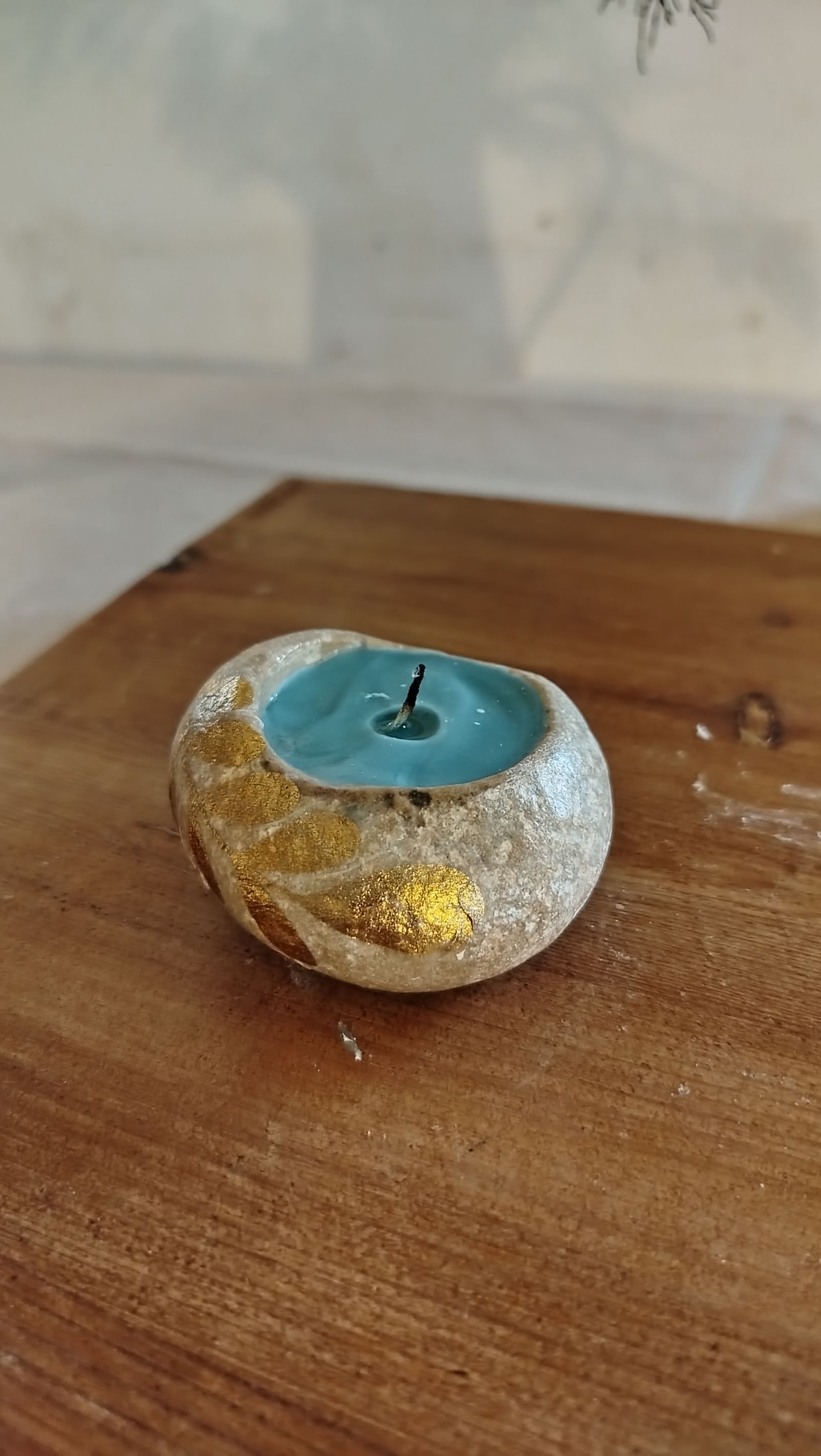 Make it see like someone is gently pouring wax from a can into the candle (The candle is empty at the beginning)