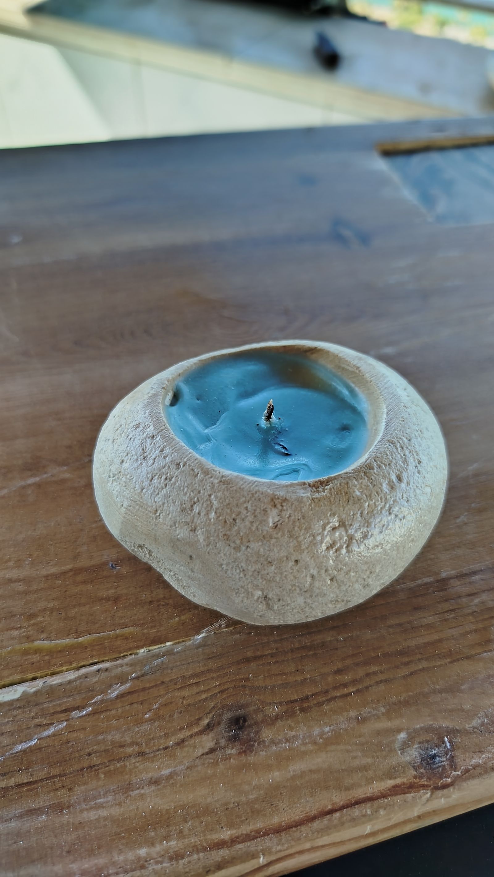 The candle is burning in the wind turns the flame off eventually