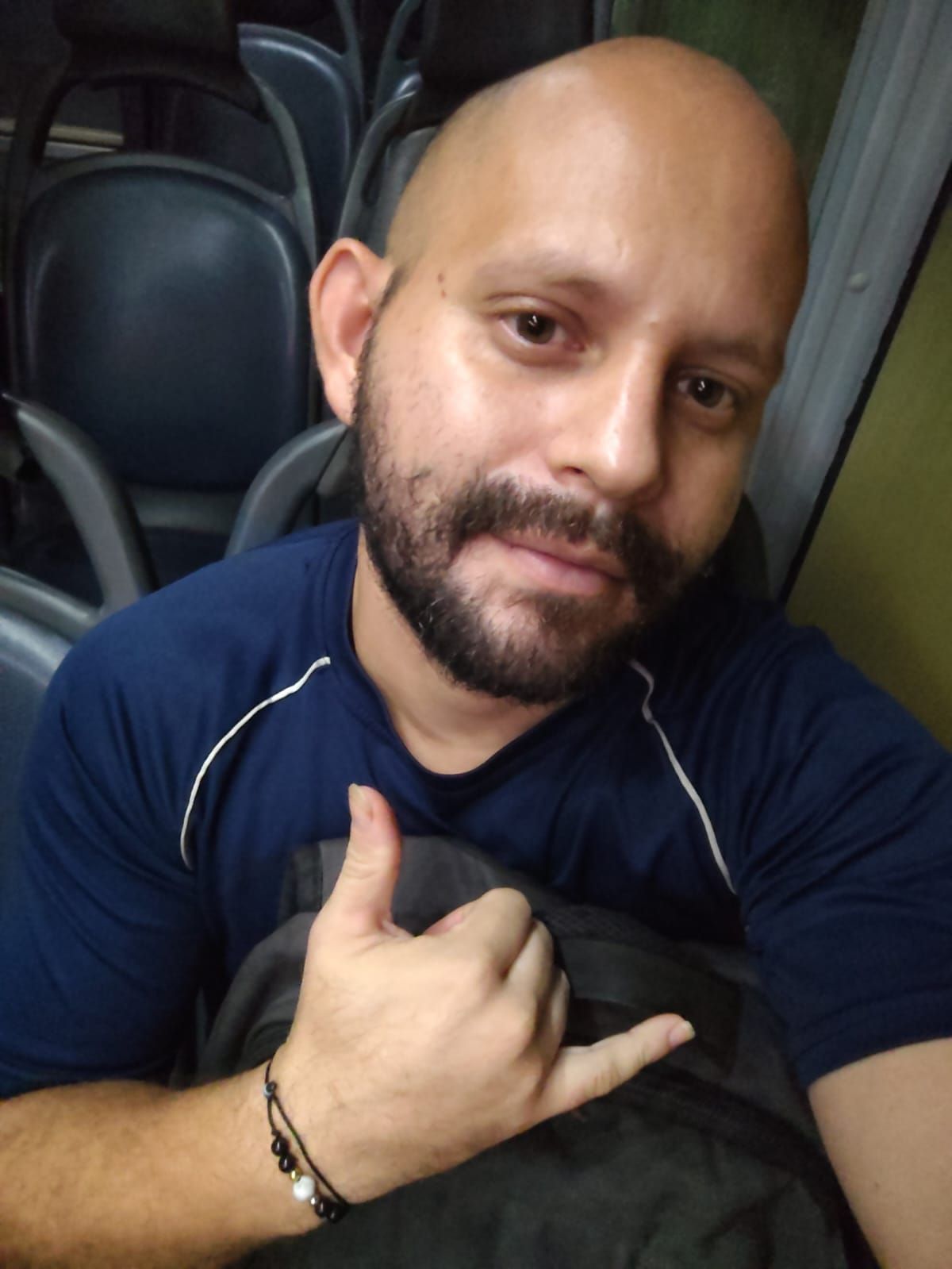 A lone astronaut stands on a desolate alien planet, gazing at a swirling nebula in the night sky. The landscape is dotted with strange, crys...