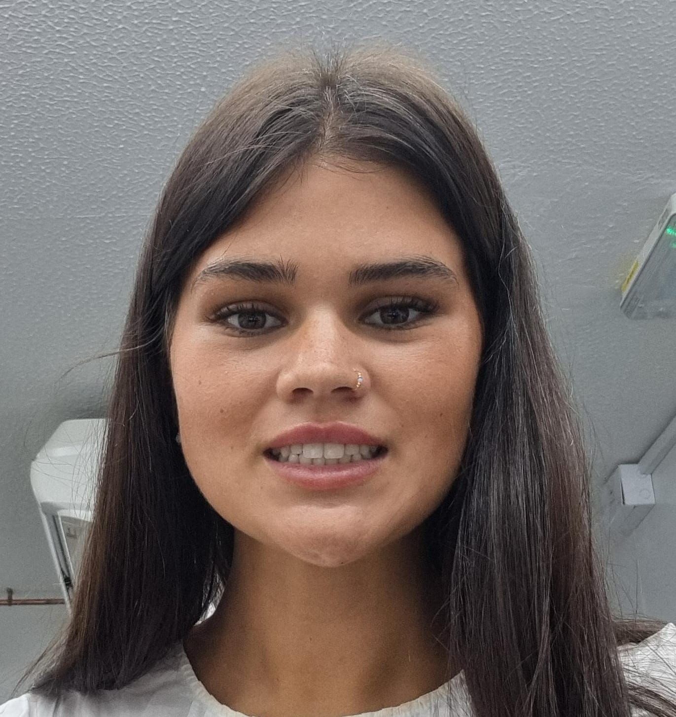 A friendly bear that has the face of this image as the face of the big cuddly bear but make it look like a real bear