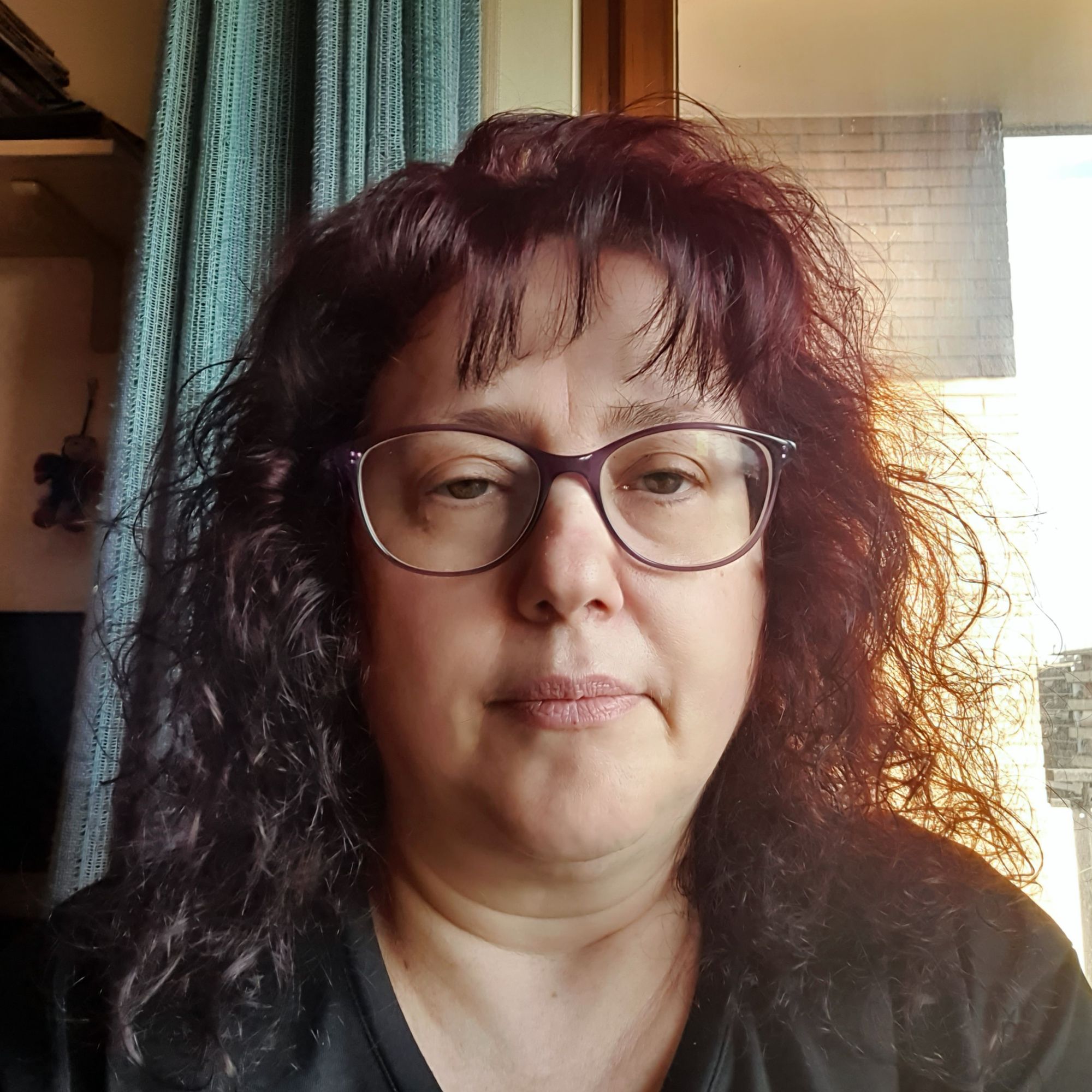 Brunette 19 year girl with eyeglasses.