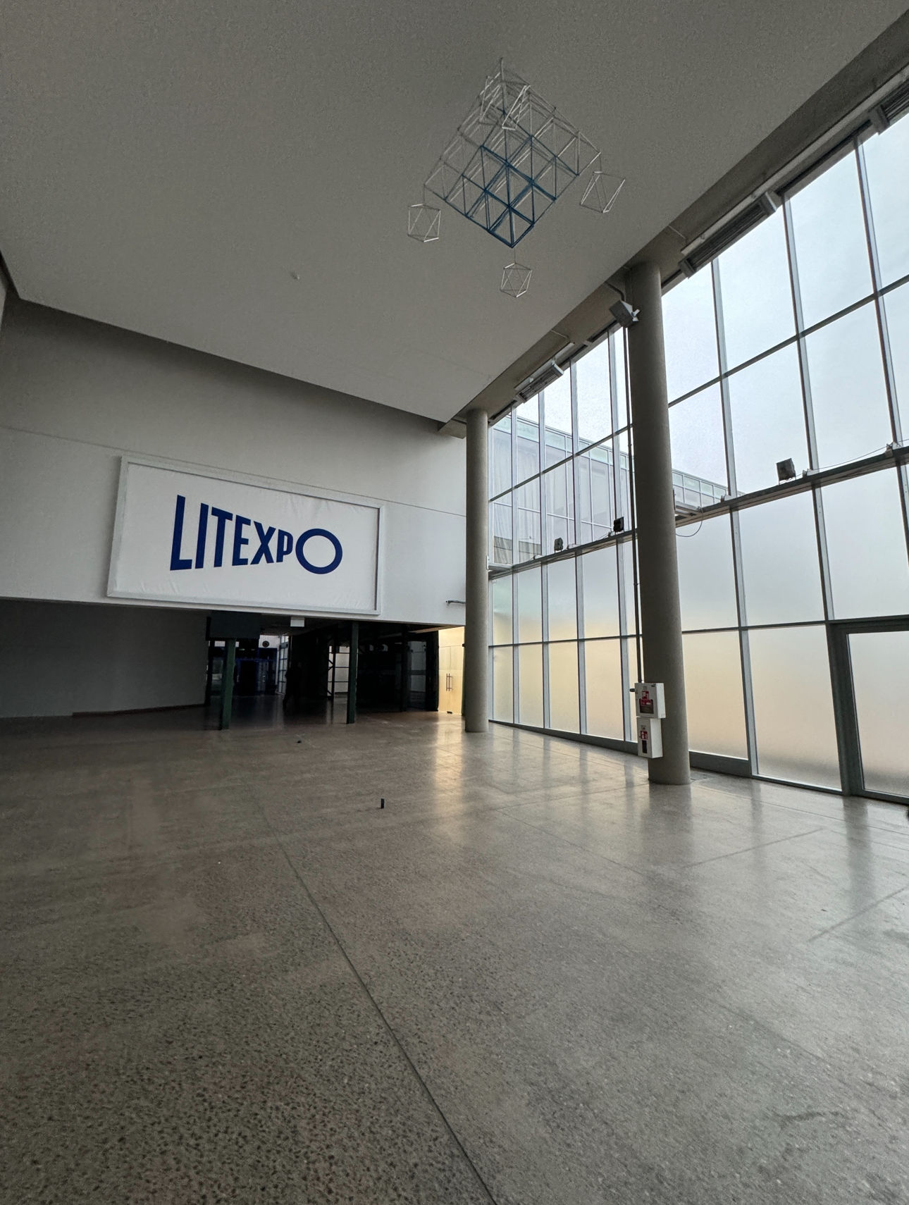 <lora:Dark fantasy realism:1.0> <lora:eye:1.0> In the corner there is a High and contemporary royal crown shaped art installation made with...