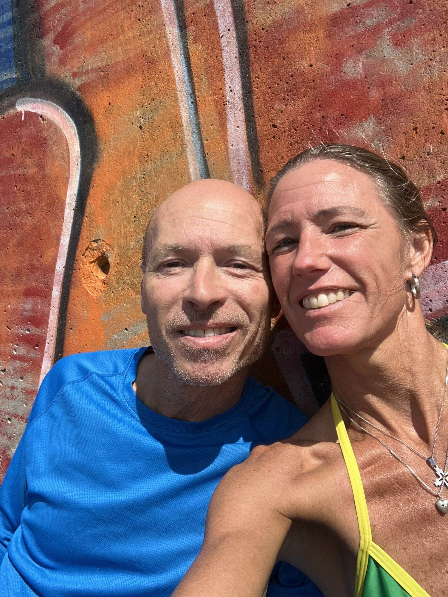 Use the picture and create a new photo-like picture of me and Fredrik when we attend our future marriage in 1 year´s time. I wear a long whi...