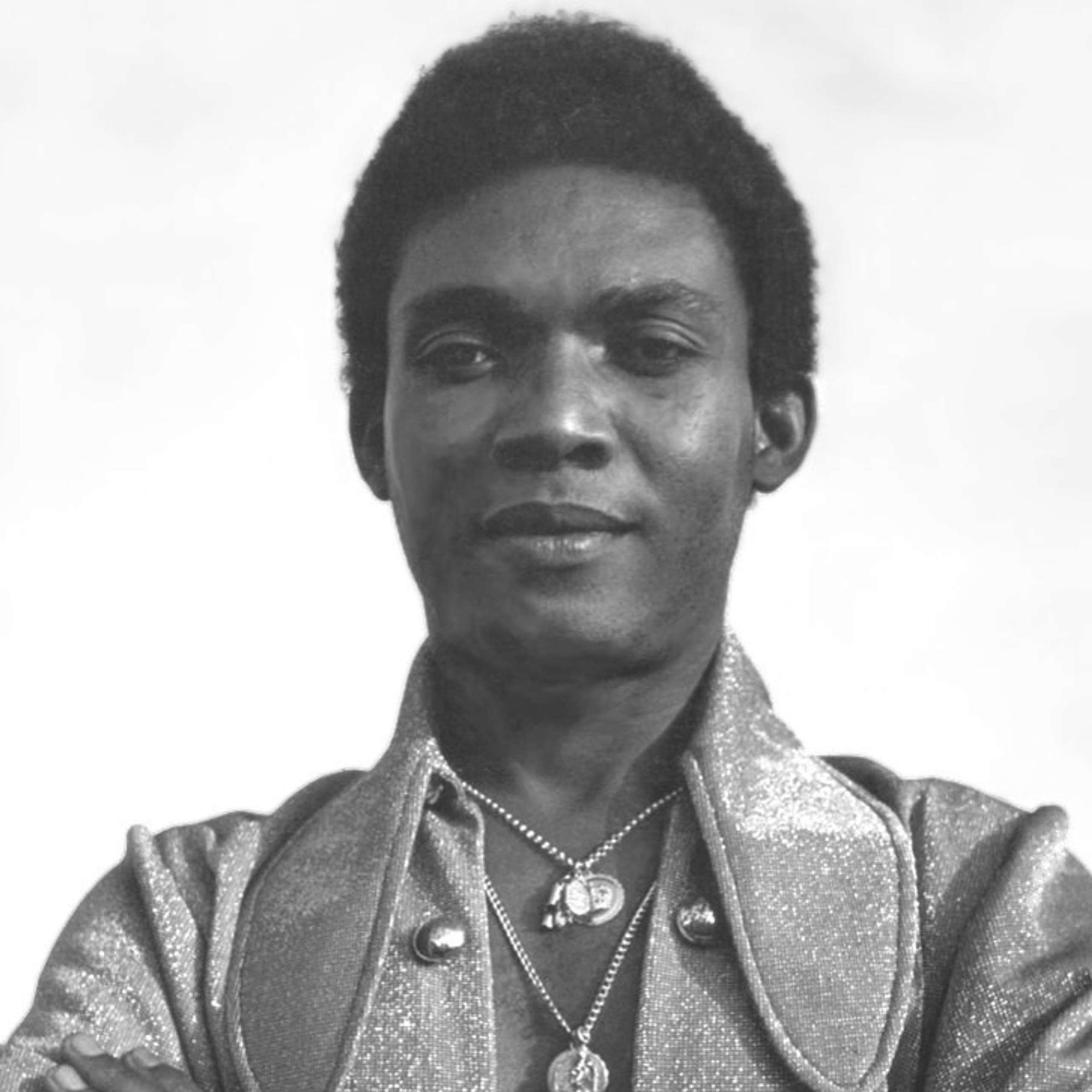 Create and image of the singer Ken Boothe- (the singer of Everthing I own) in his late 20s on stage in  theatre circa 1960s. He is well it a...