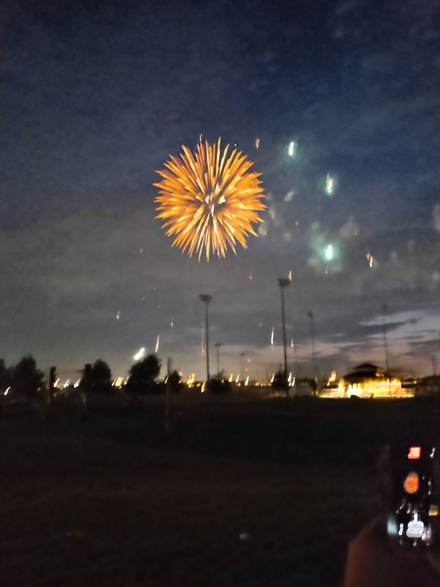 a woman in a colorful dress standing in a doorway with a bright light coming through it, by Michael Hutter