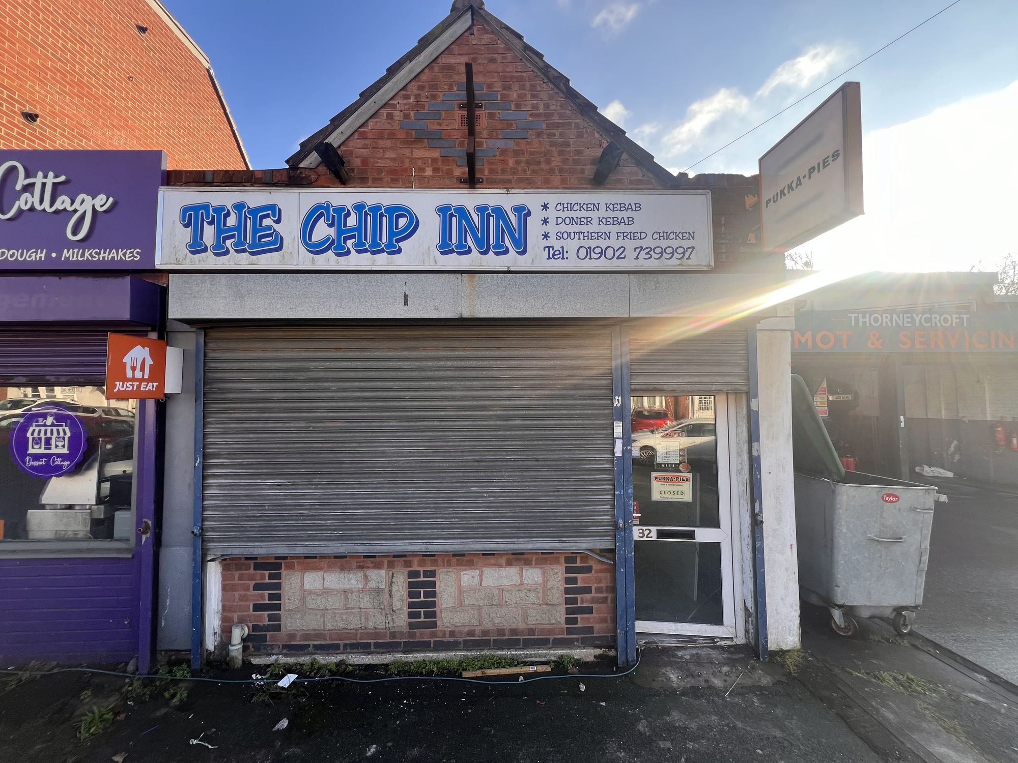 Modern styling. Shop name is iFry. Remove shutters and replace with window. Windows need shop logo. Use colours black, white, blue, yellow a...