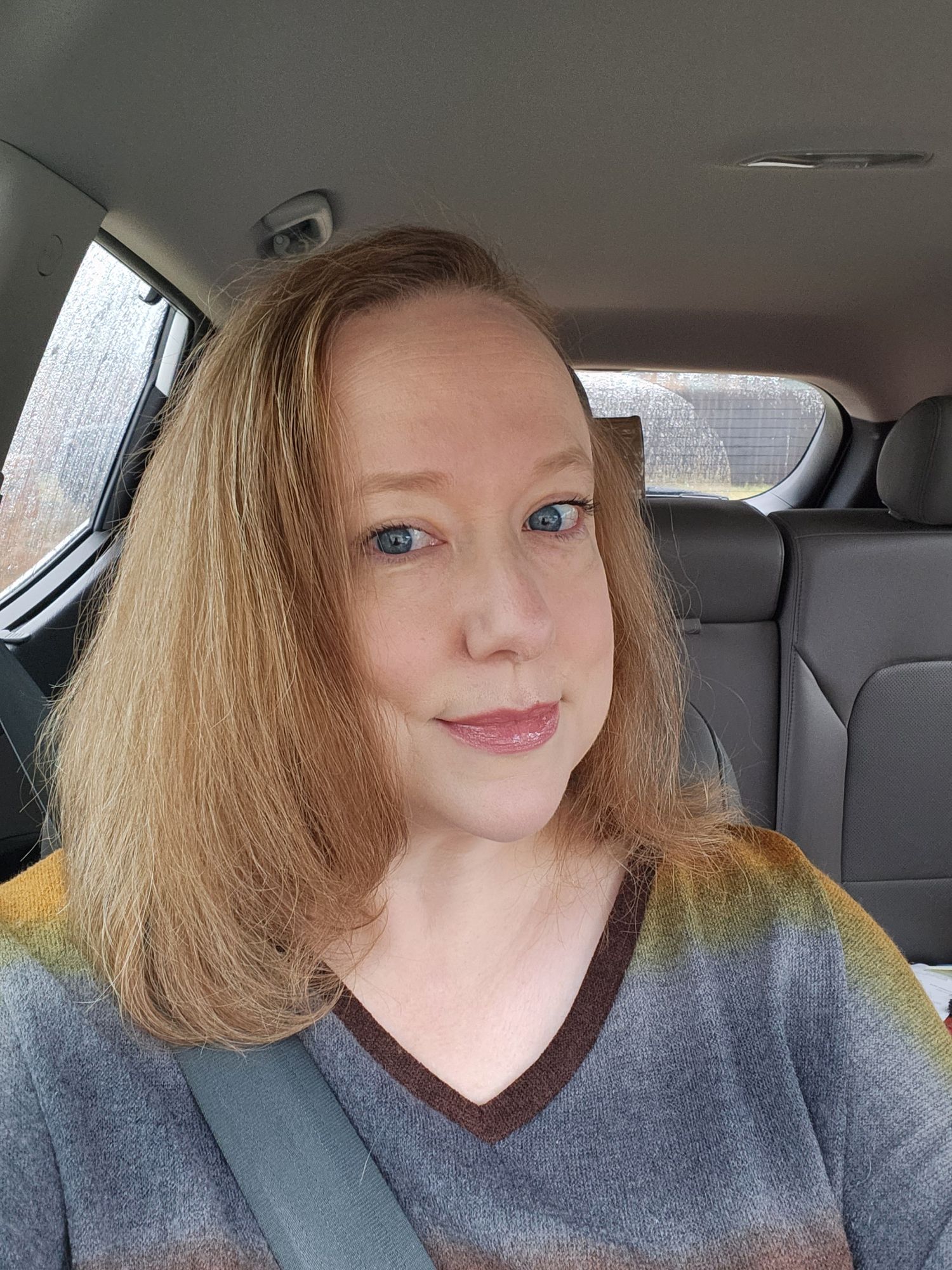 Redheaded female D&D elven ranger with blue eyes clopping down a cyberpunk cityscape on a massive steed  searching for her lost human male c...