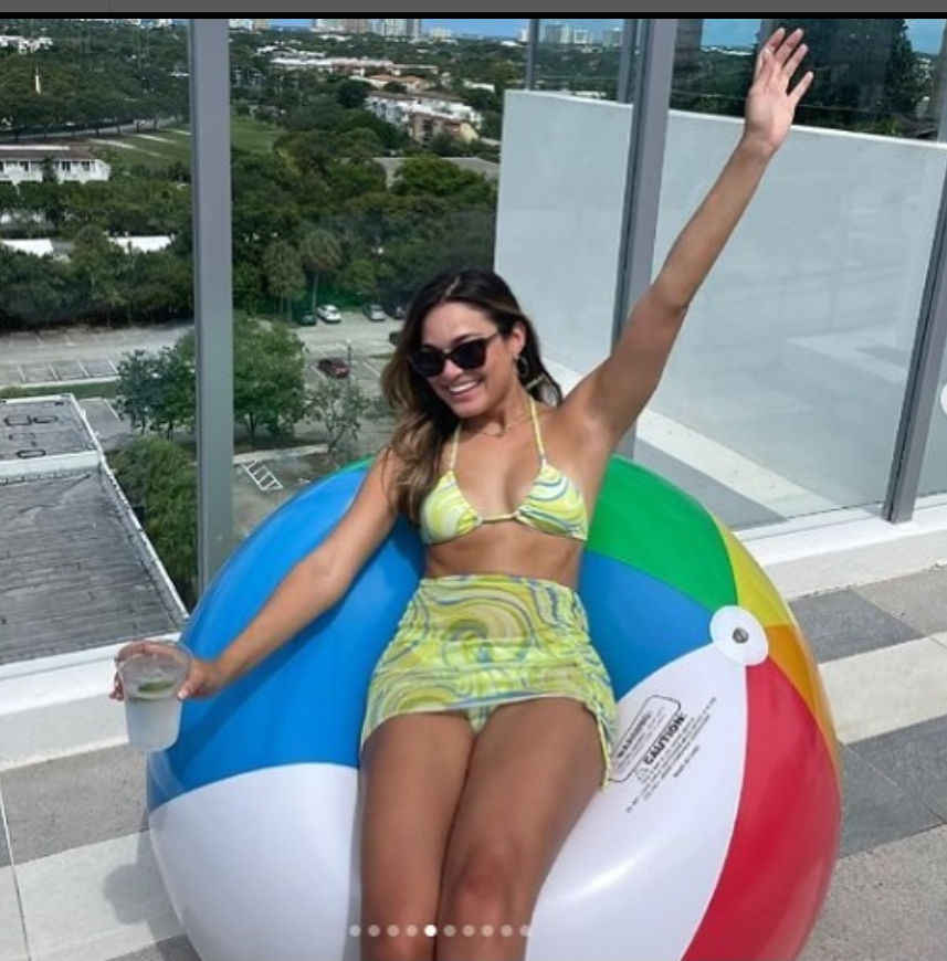 British woman on a 60-inch beach ball. 
