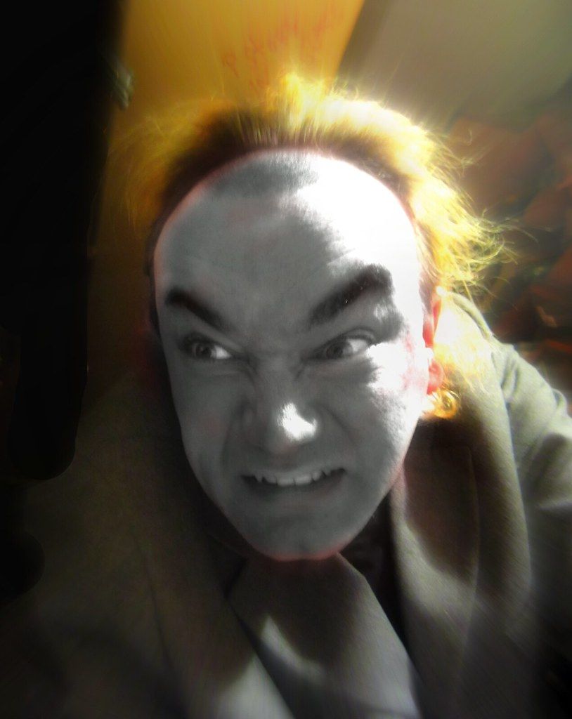 A photo of a lunatic madman caught on camera with fake baldness and an eccentric professors unkept fuzzy hair, in the style of realism and p...