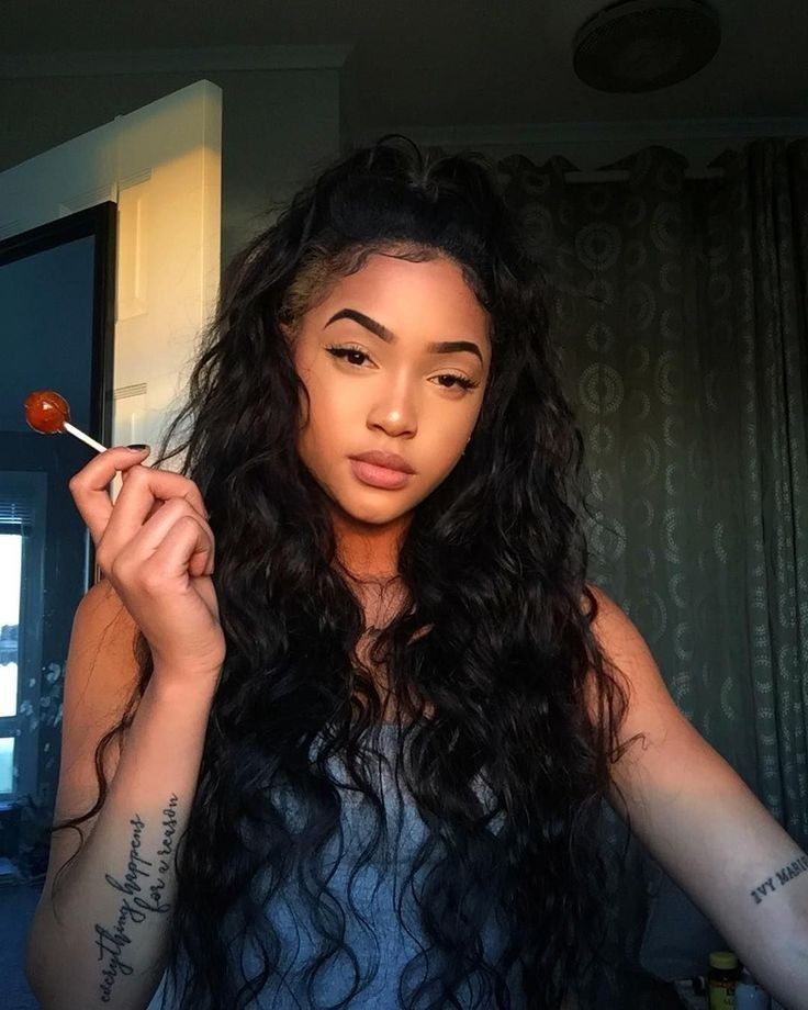 Mexican Latina, 18 years old, wearing jean pants, with long curly black hair, with the perfect smile showing teeth, looks some what native,...