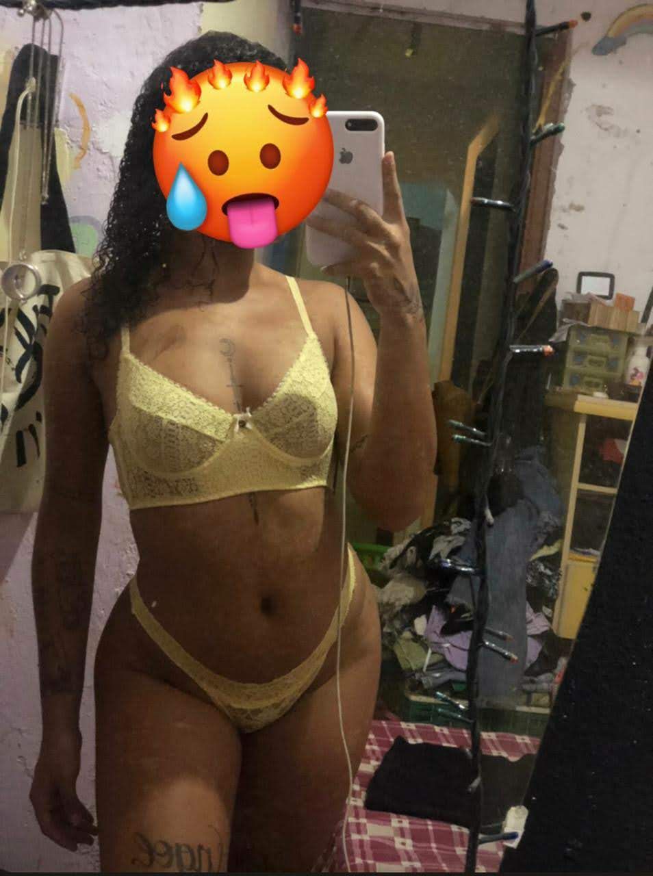 A hyper-realistic full-body portrait of an alluring young woman standing confidently. She has bronze skin with subtle freckles and voluminou...