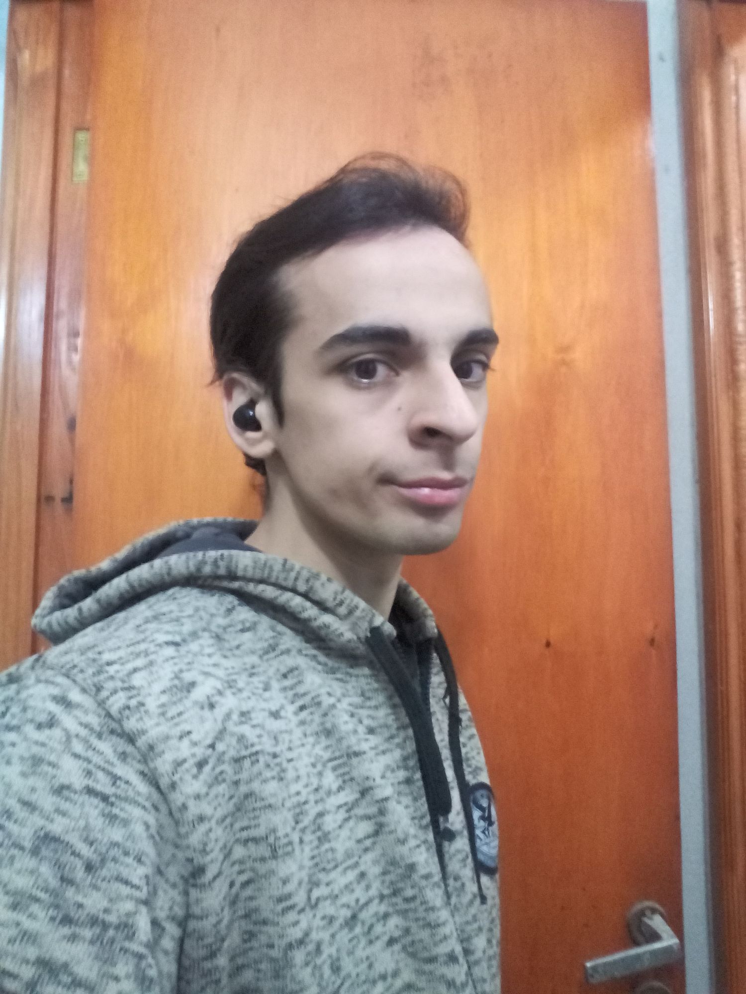 a cyberpunk detective men with Noire style, on a rooftop, loocking a the camera whit a city view behind him, wearning a black gabardin