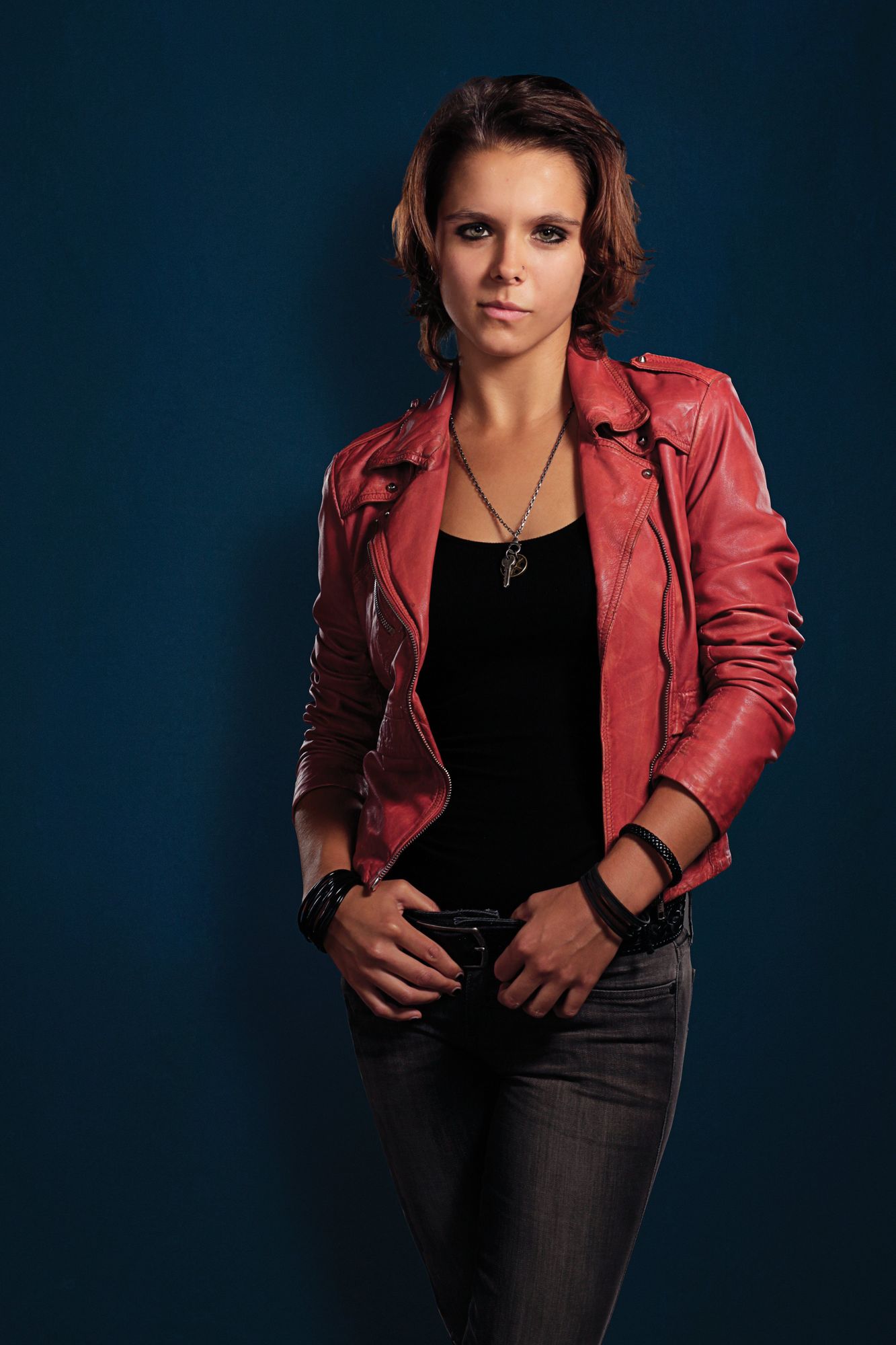 Dakota Johnson ultrarealistic face, super detailed ultrarealistic, Dark hair, ultrarealistic superdetailled white shirt and blue leather bik...