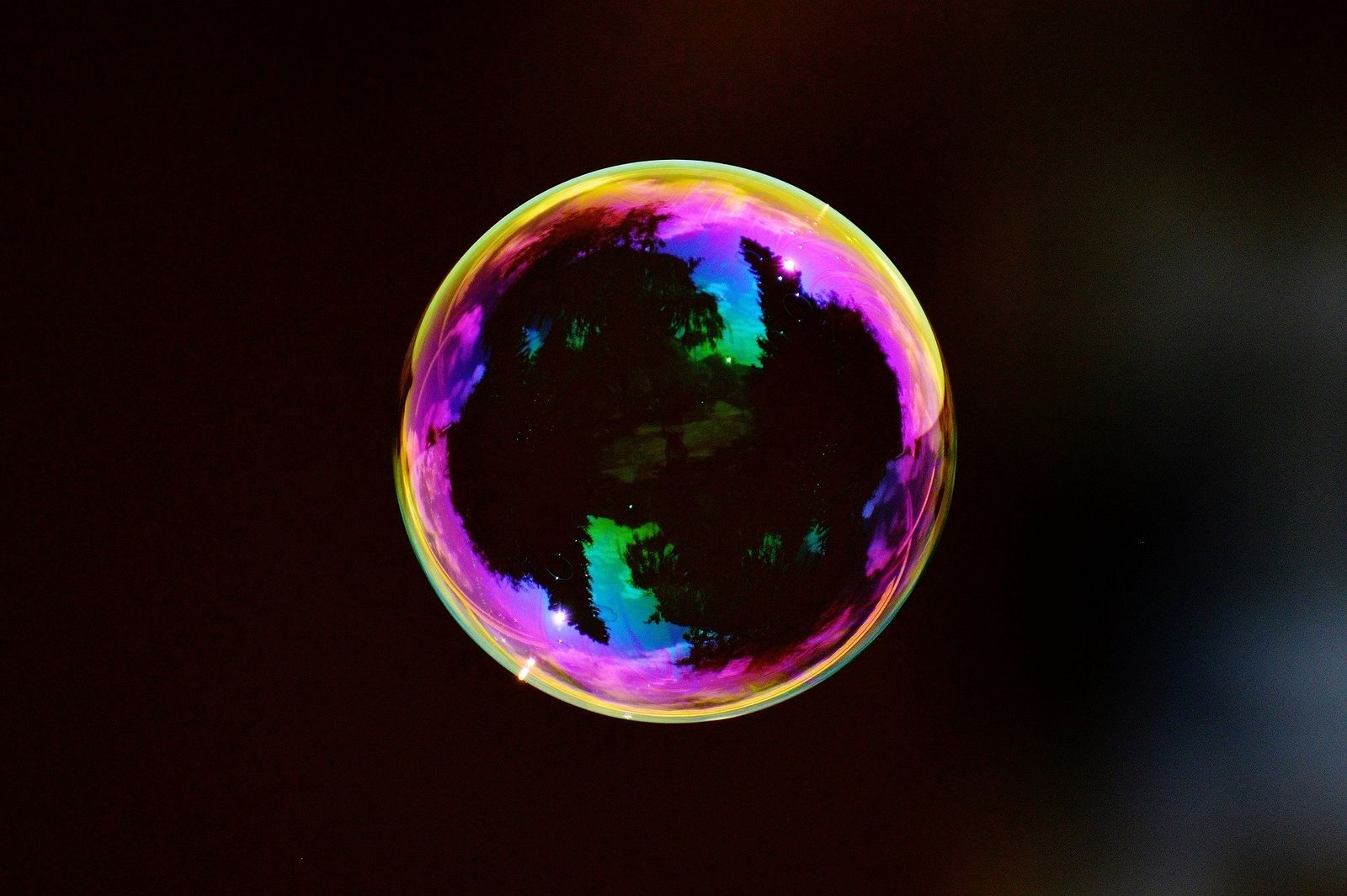 bubble exploding into colours