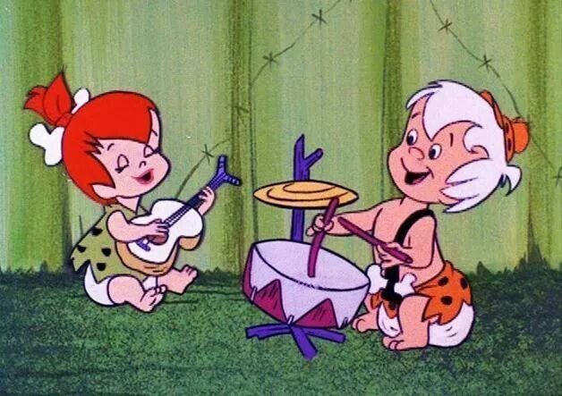 Pebbles Flintstone, from the Flintstones, a female with red hair and a LONG ponytail, playing guitar, and Bam-bam rubble, from The Flintston...
