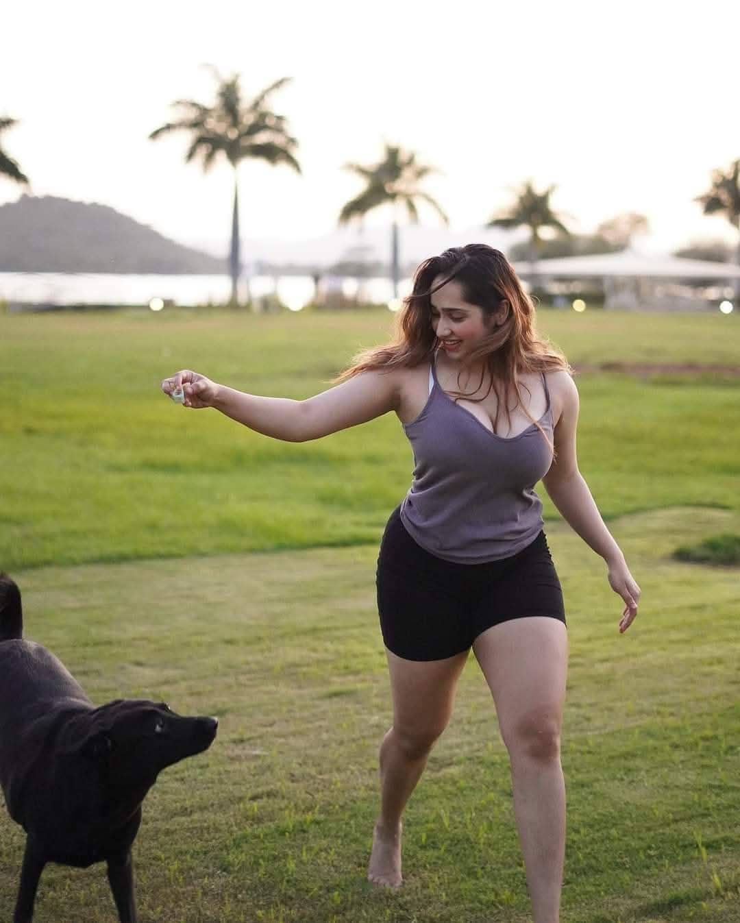 A woman jumps on the back of a dog and rides off into the sunset
