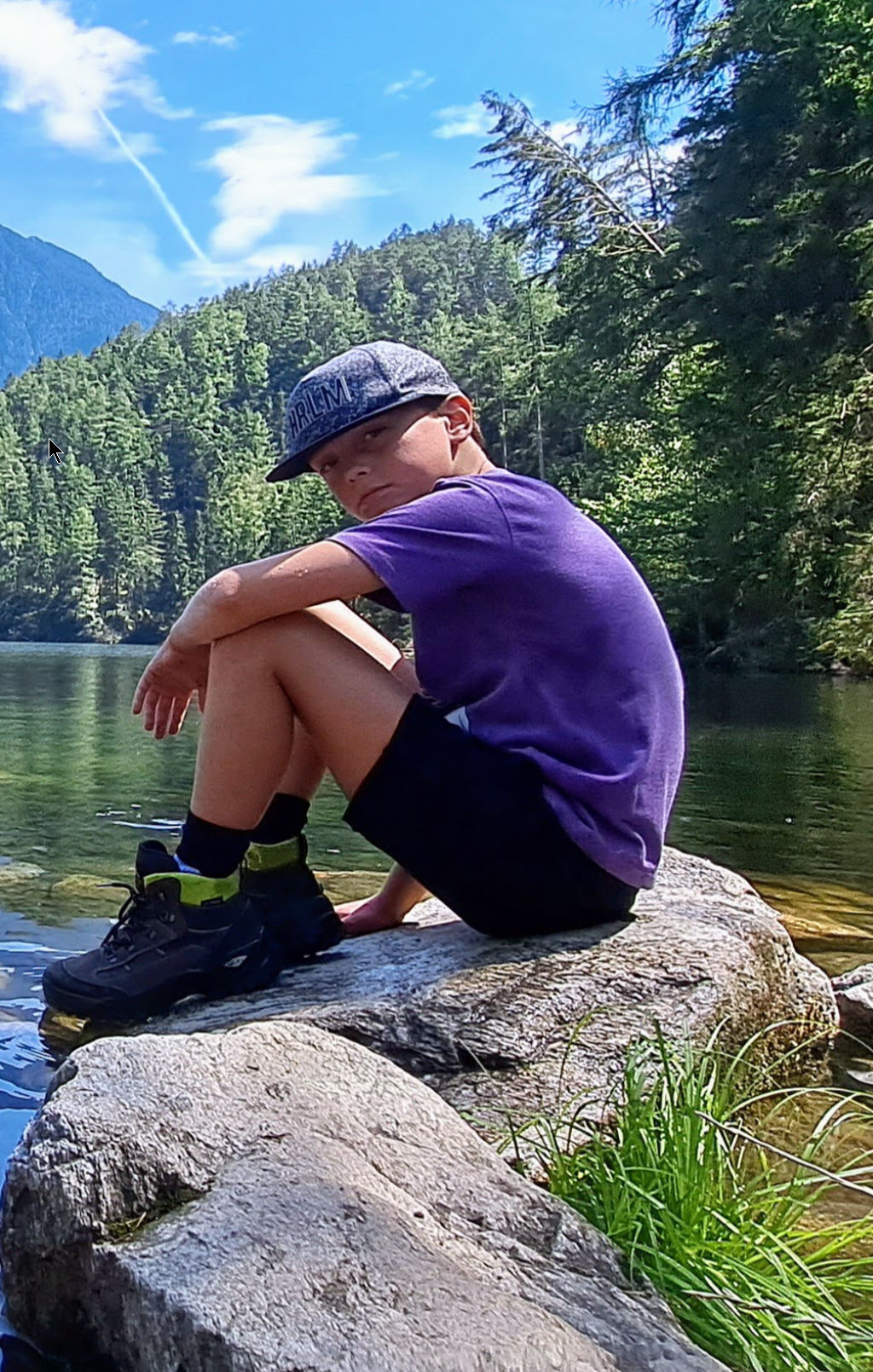 Sit on the top of a snow covered mountain overlooking a vast forest