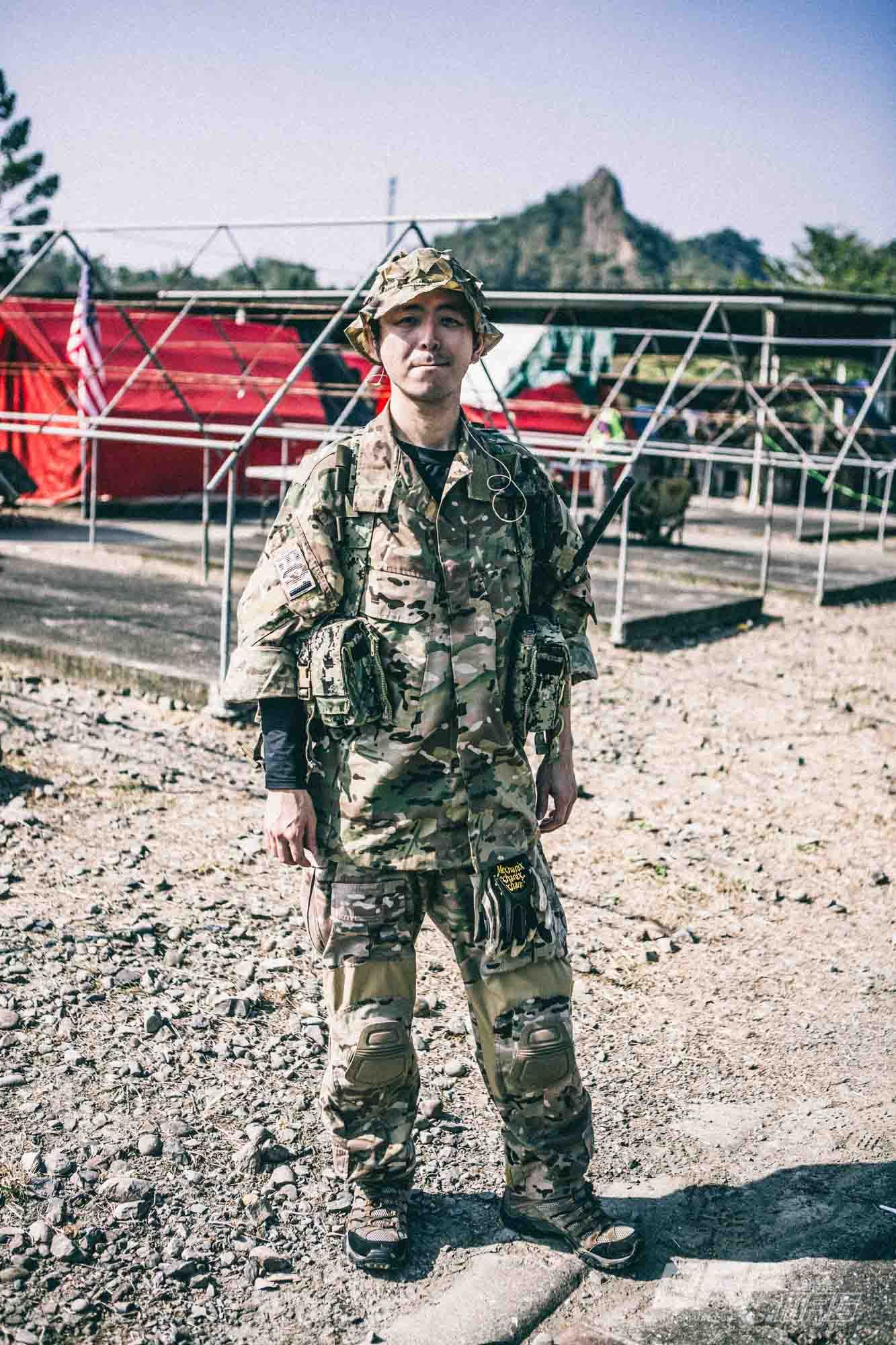 a tactical, Christmas girl, military BDU in multicam camo, chest rig, with night vision goggles, tatoo on the face, stepping into infinity.