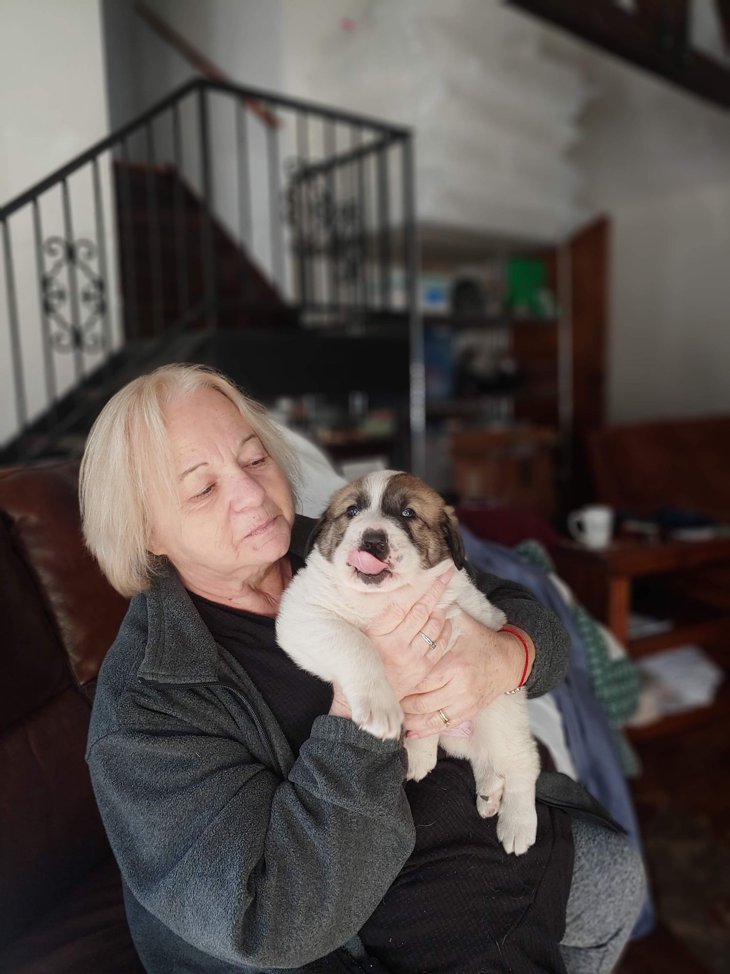 old woman holding a giant maggot 1