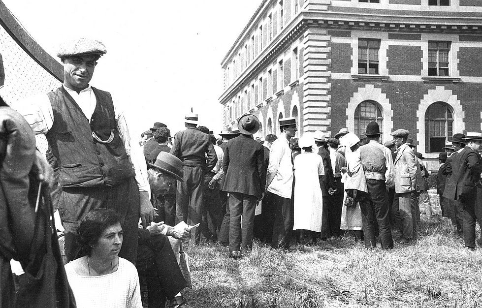 People in  ELLIS ISLAND  at the beginning of the last century