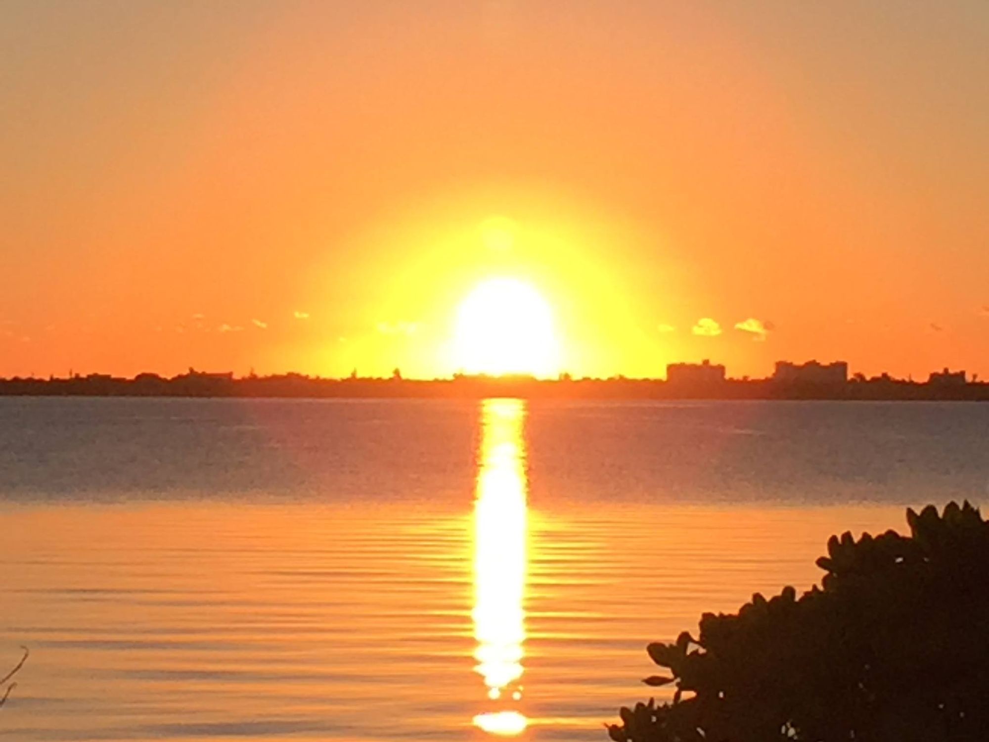 Surfer on a wave at sunrise using cubism Jim Warren style 
