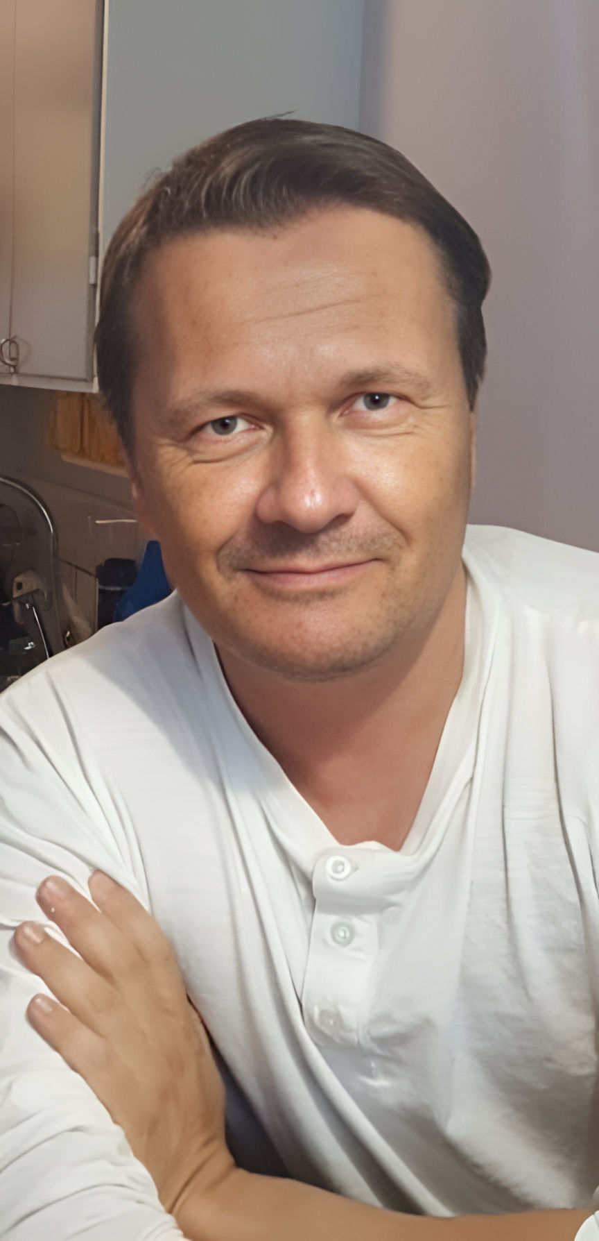 Remove the skin and the cartoon style of the same man standing left