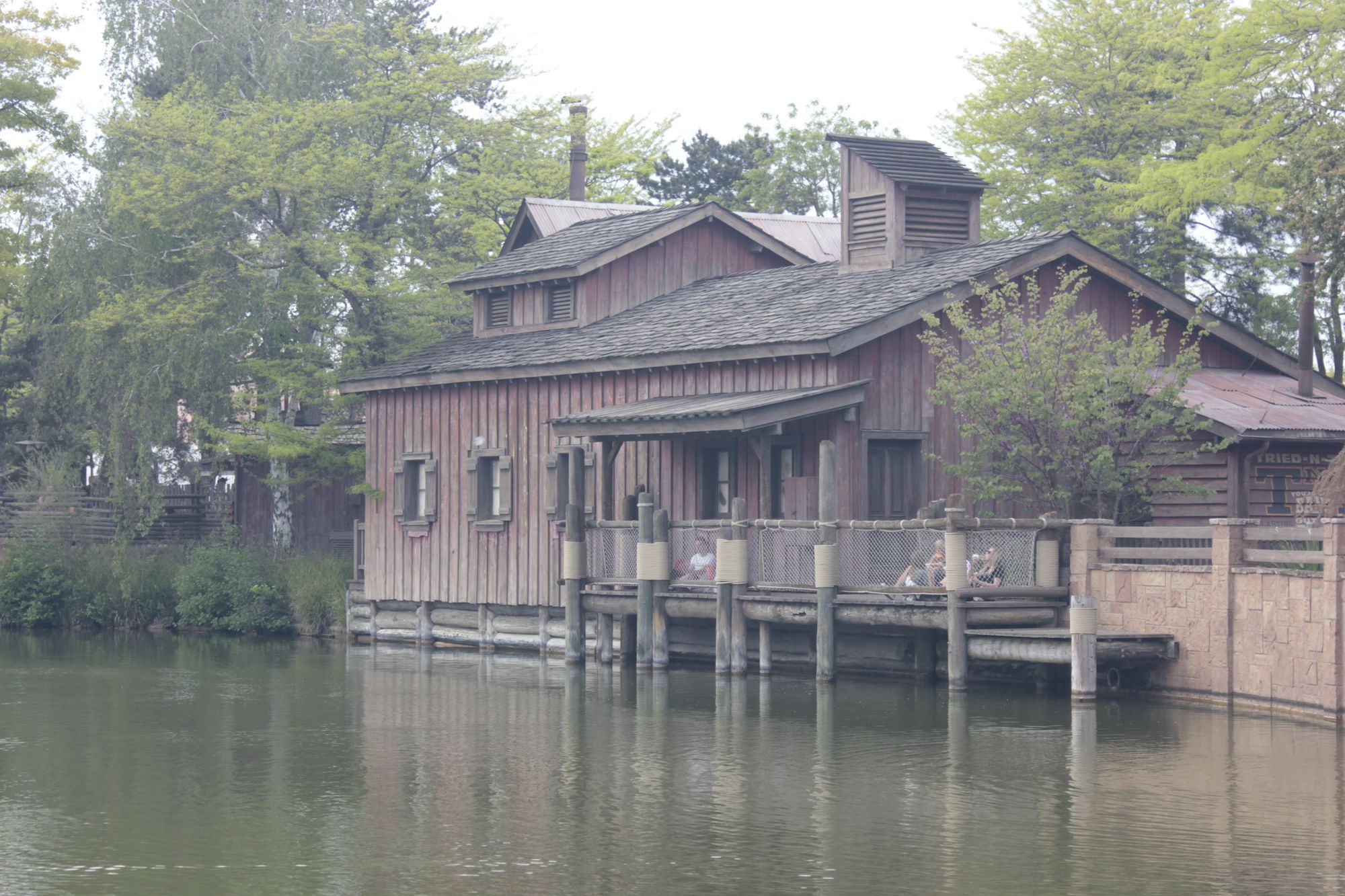 Picture a gorgeous landscape, included a medieval bridge, a river and a medieval castle. Render is a mixed watercolor and oil painting techn...