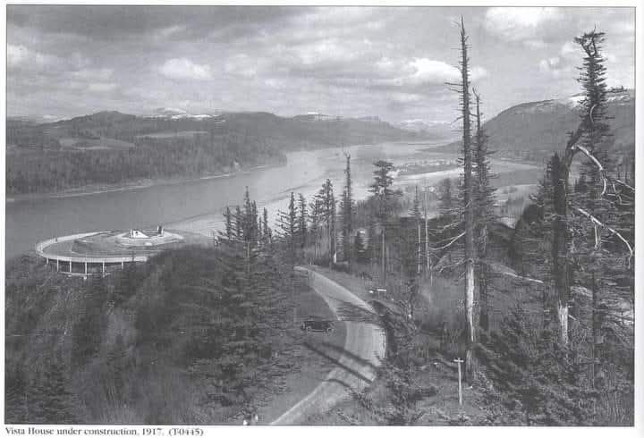 Timelapse of building new roads, the river flows from left to right, timelapse from the 1930s to the 2000s, new trees grow, houses are built...
