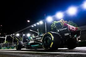 lewis hamilton f1 car number 44 mercedes night time in japan