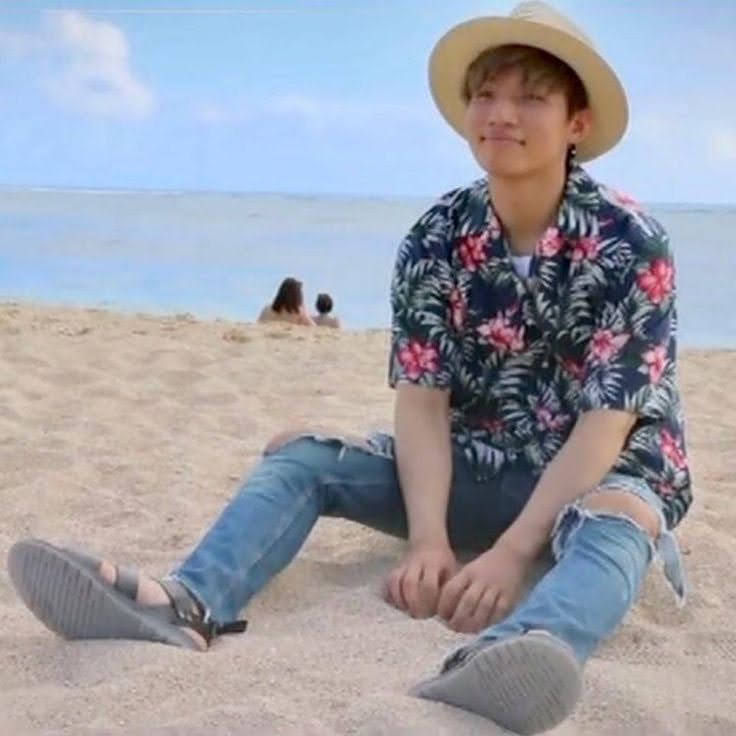Jin of BTS has a very happy moment at the beach for his summer time
