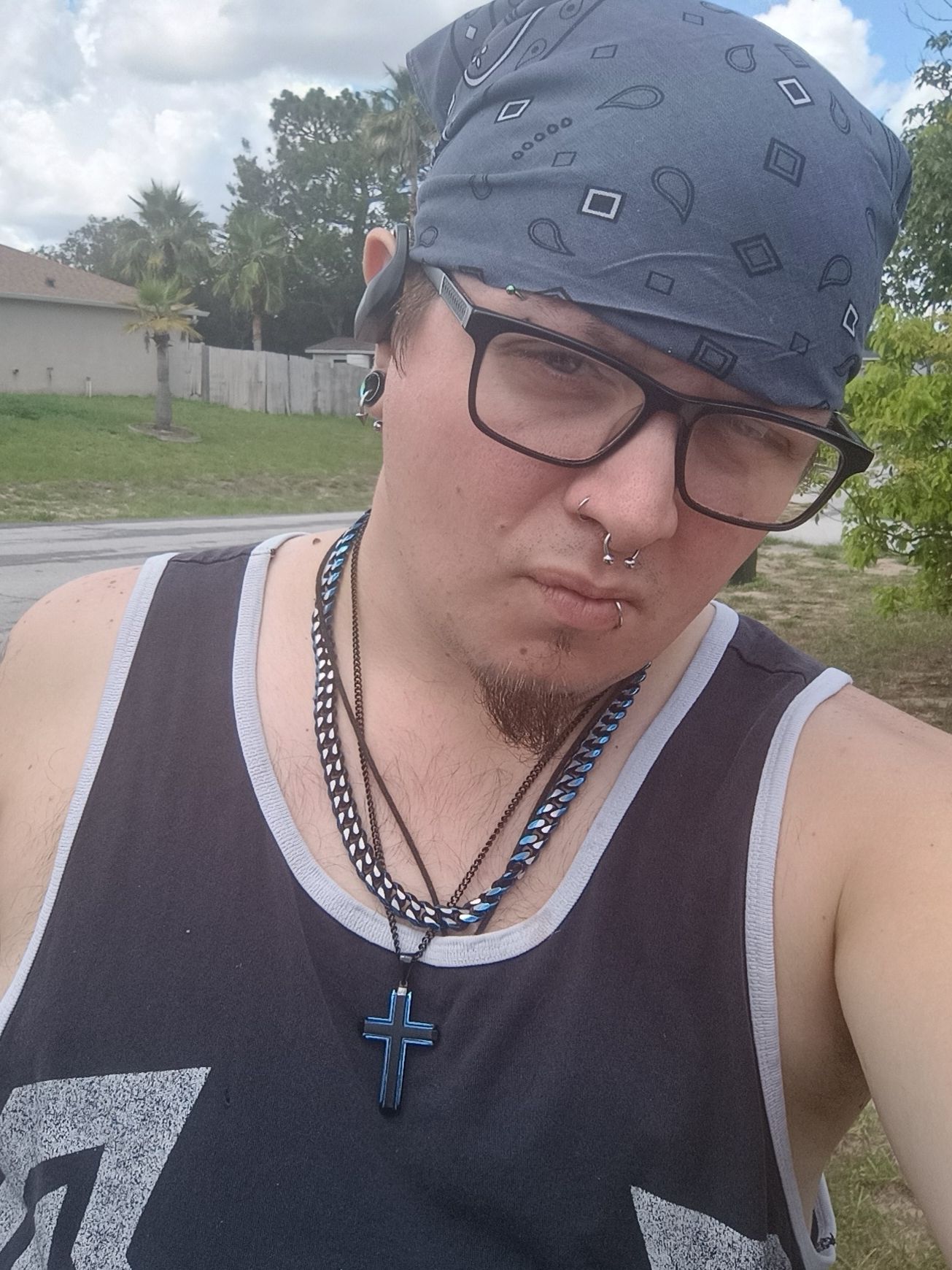 Make a man with a glitched out features the background a cybernetic circus with fire 