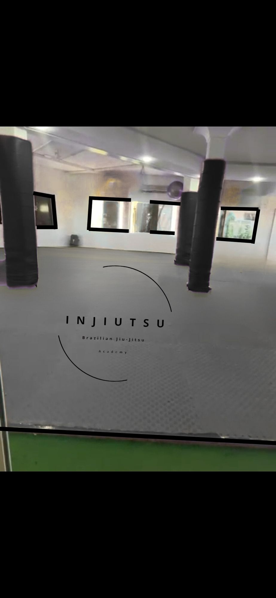 Clean, detailed and professional 2D floor plan of a Brazilian Jiu-Jitsu training room, with clear sharp lines, tatami mats, training equipme...