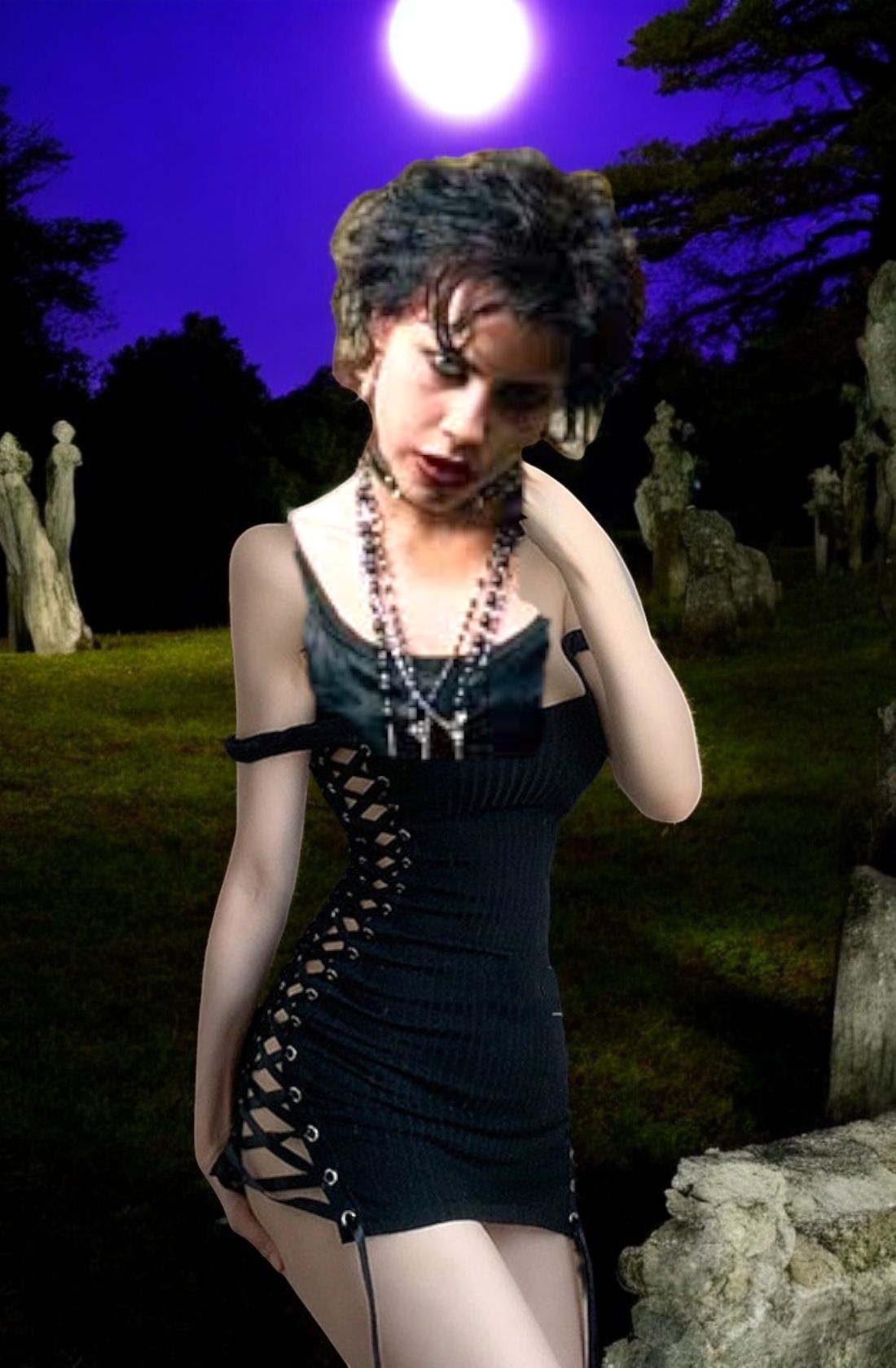 Young Fairuza balk it's a long hair and an evil expression on her face with vampire fangs in a dark scary graveyard with a full moon and a d...