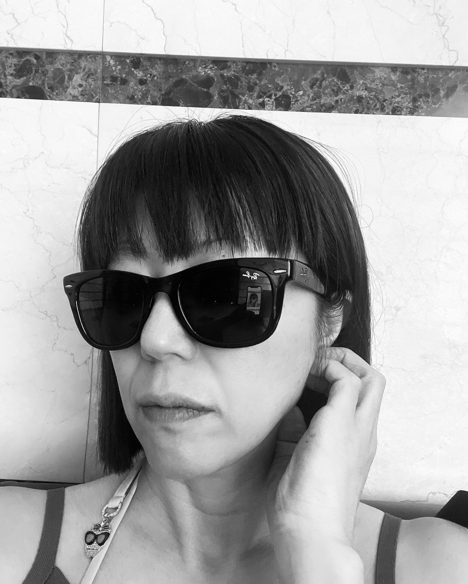 Professional monochrome portrait of a modern editor-in-chief. 
Realistic photography style, soft lighting, elegant and modern. 
Neutral back...