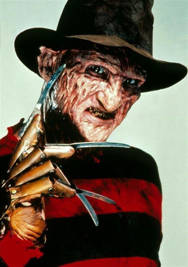 This exact same Freddy Kruger in Bratz dolls aesthetic with porcelain finish. Medium shot of Freddy Kruger  with all over burns on his skin...