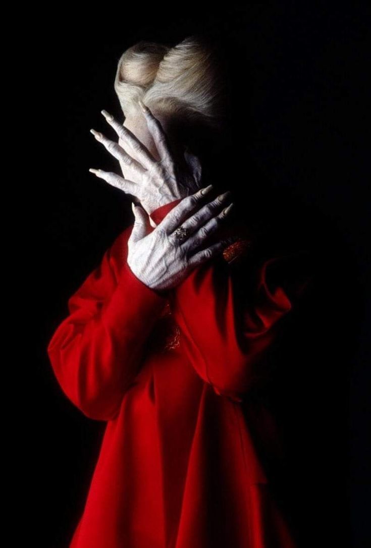 Dracula dramatically trying to shield his face from the rising sun, highly detailed,  
Cinematic film still, shot on v-raptor XL, film grain...